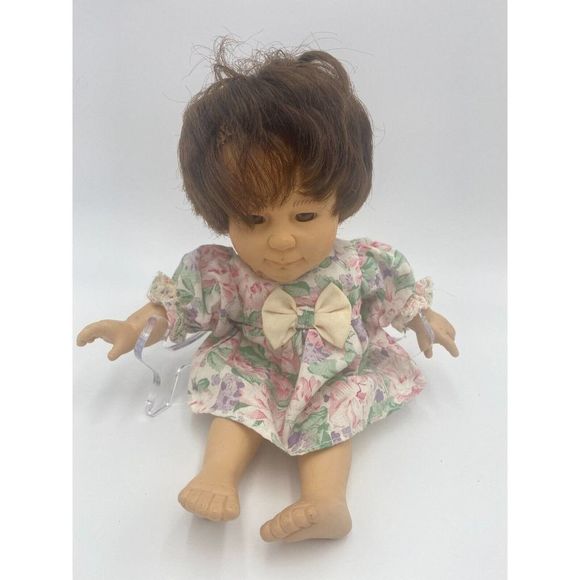 Baby so beautiful body is soft head hands legs are hard pink dress with flowers - Picture 1 of 4
